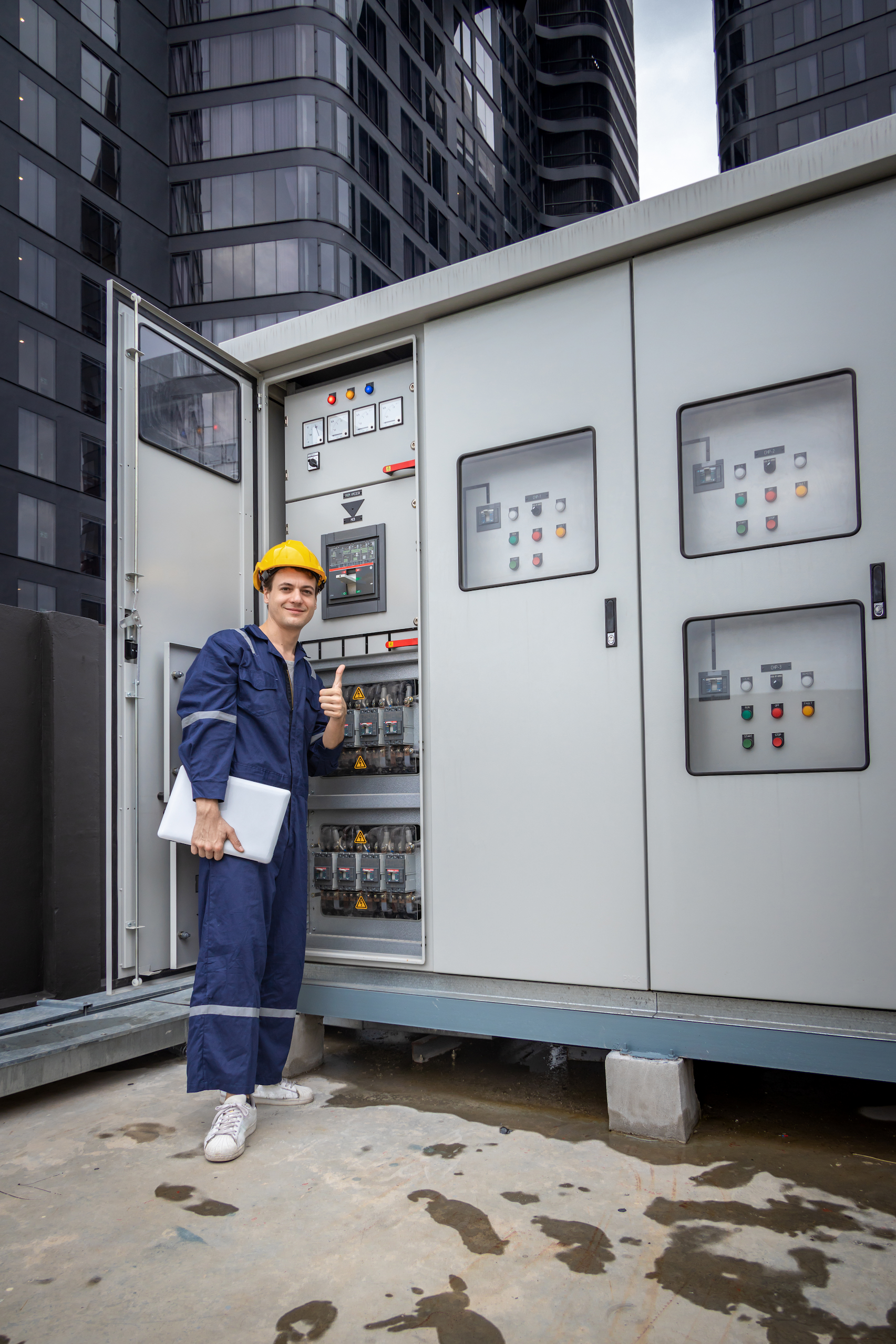 Electrical engineer working in control room. Electrical engineer